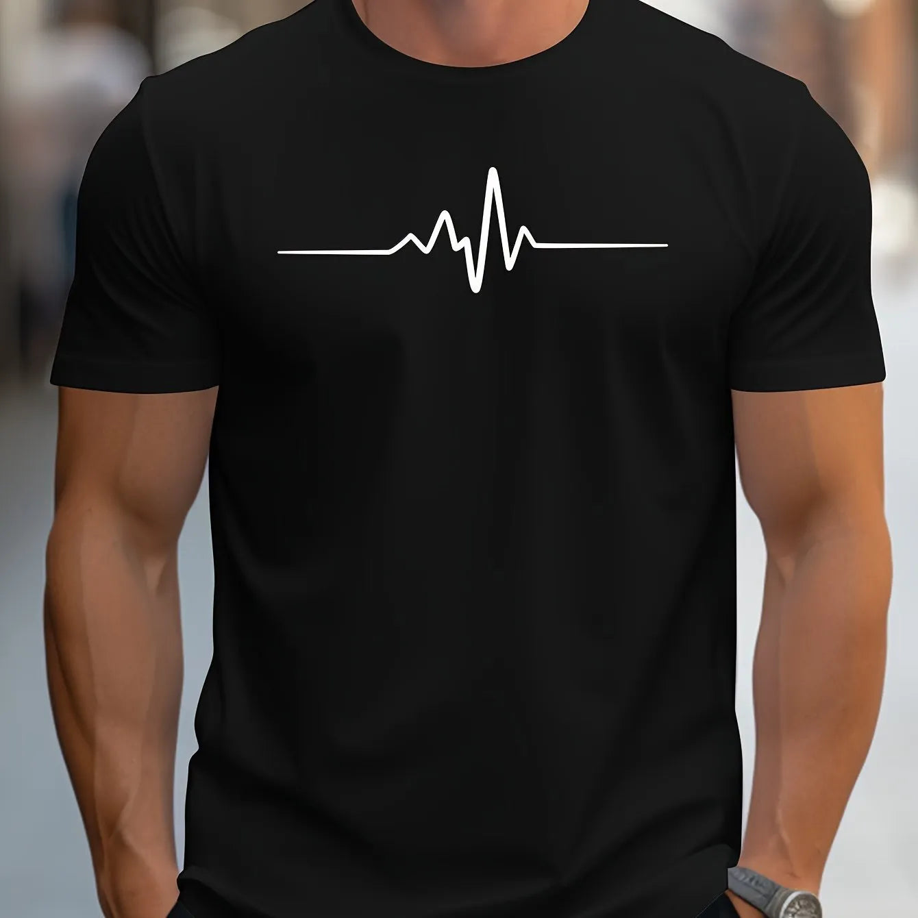 Male model wearing a loose fit grey t-shirt with a colourful 3D graphic print on the front.