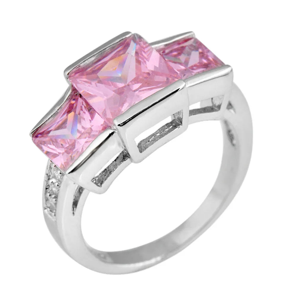 A geometric copper ring in multiple colour options on a size chart showing rings 6 to 10.