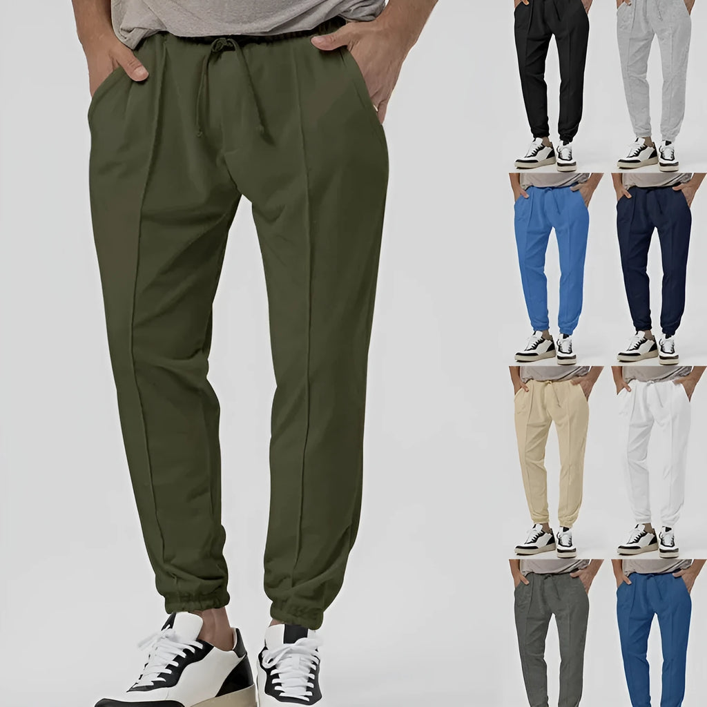 Men's grey straight-leg casual sweatpants with elastic waistband, shown laid flat.