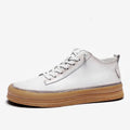 Men's black and white casual leather shoes with round toe, flat heel, and lanyard closure.