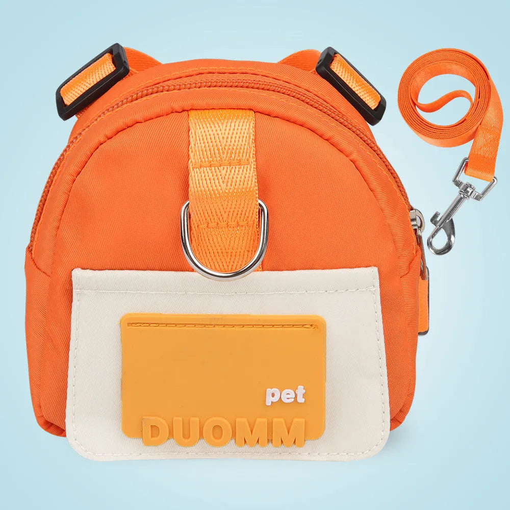Blue adjustable dog backpack harness with storage compartments and a tow rope attached.