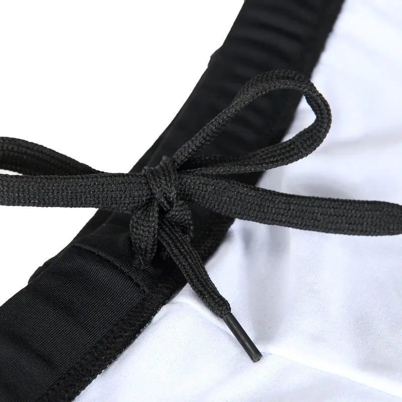 Men's plus size blue fire design boxer swimming trunks with matching swimming cap on a black background.
