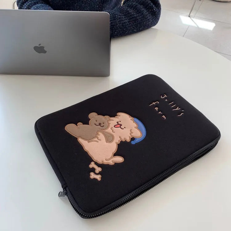 Embroidered laptop sleeve with animal design showing polyester construction and laptop size compatibility