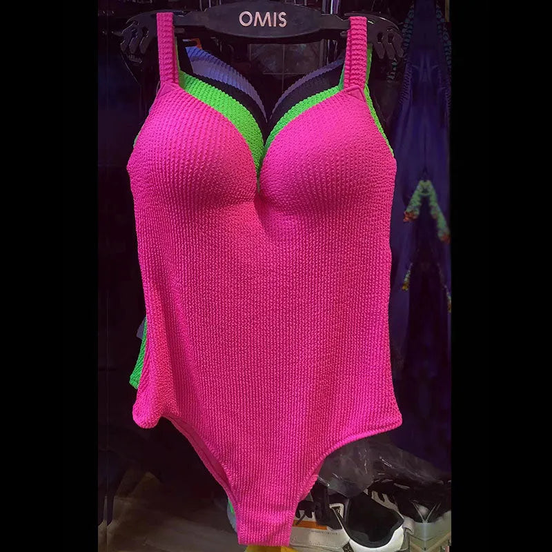 Women's one-piece swimsuit with sunkissed stripe pattern in sleeveless design showing colour options