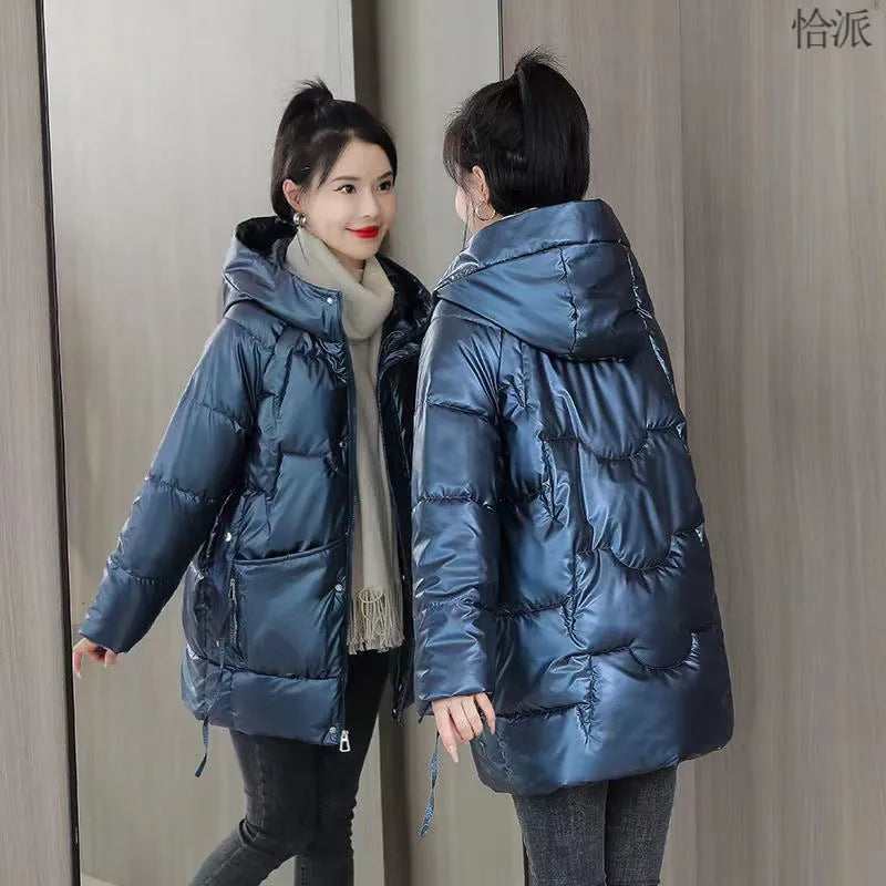 Women's loose thick hooded winter jacket in green, shown with long sleeves and a front zip.