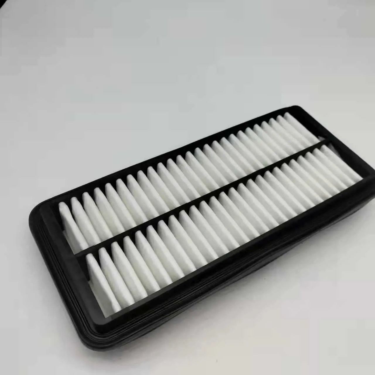 Modern car air filter replacement with dimensions 256mm by 113mm by 40mm, black filter element