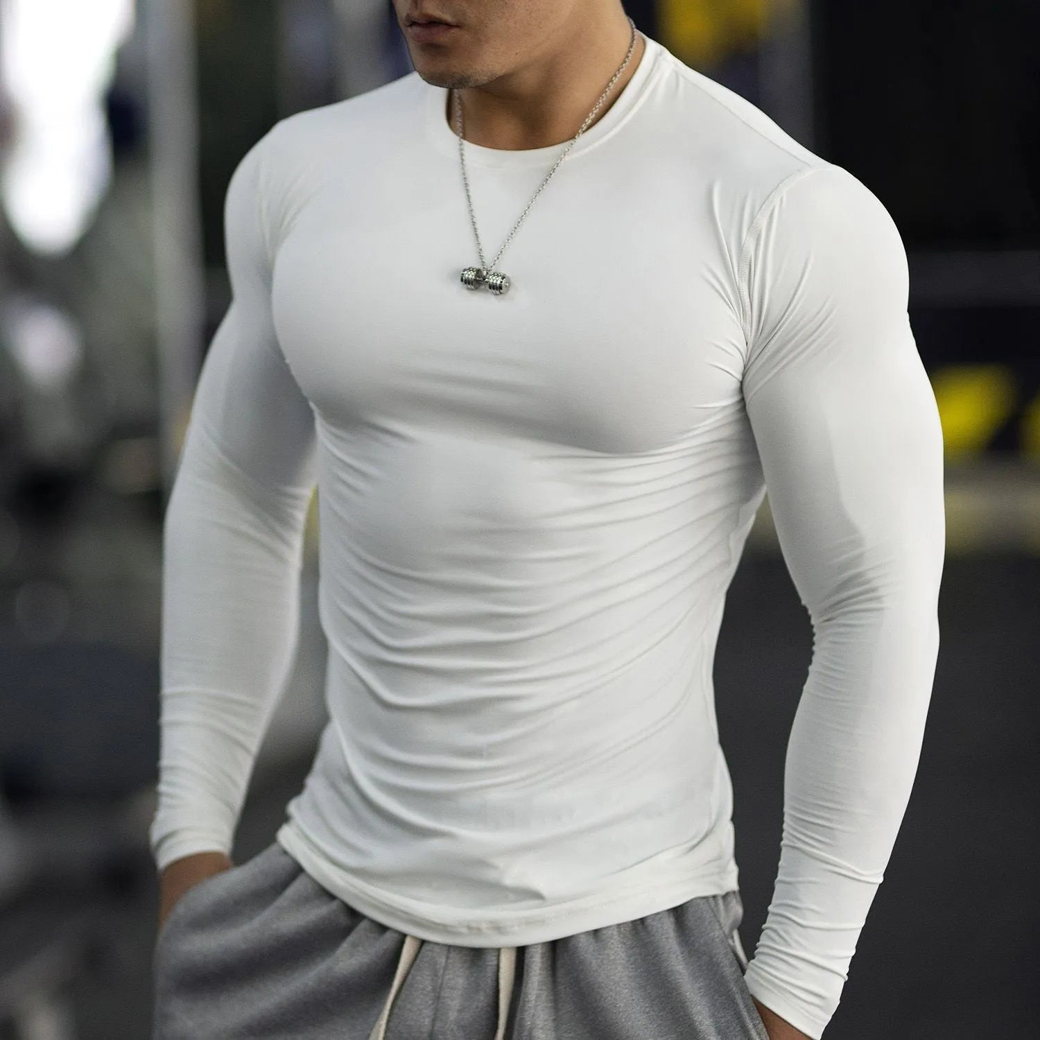 Men's black long sleeve fitness compression tights for running and gym workouts