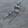 Geometric long pendant earrings in antique silver with rhinestone details on a stud.
