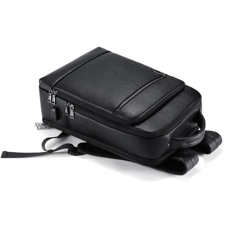 Black genuine leather men's business backpack with curved shoulder straps and sewing line detailing