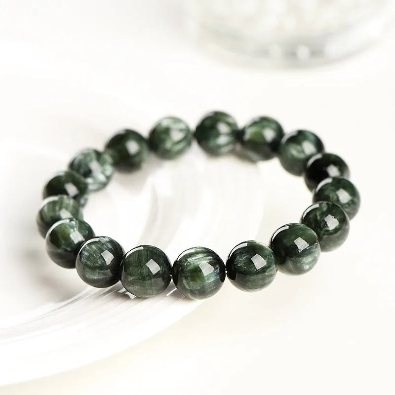 Green Dragon Crystal bracelet with round 8-9mm beads and a single ring clasp.