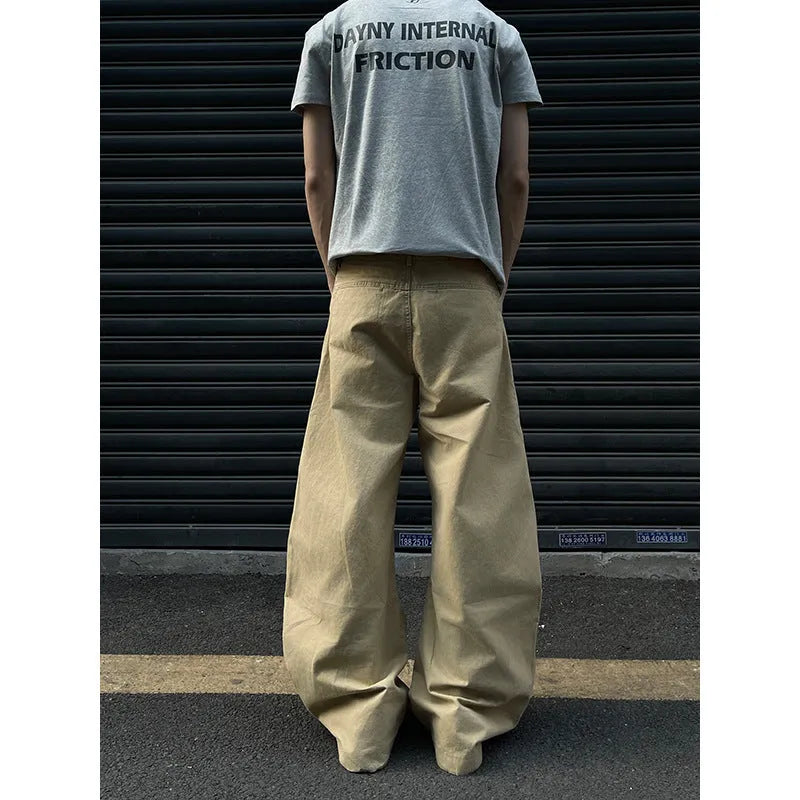 Men's khaki-coloured straight-leg cotton trousers laid flat, showing American retro casual style.