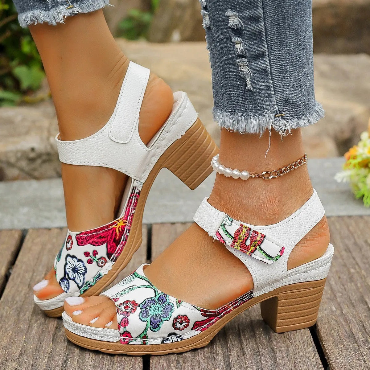 White women's high heel sandals with a Velcro strap fastener on a casual rubber sole.