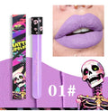 Halloween creative makeup lip gloss in a skull test tube, showing metallic gold and silver retro matte shades.