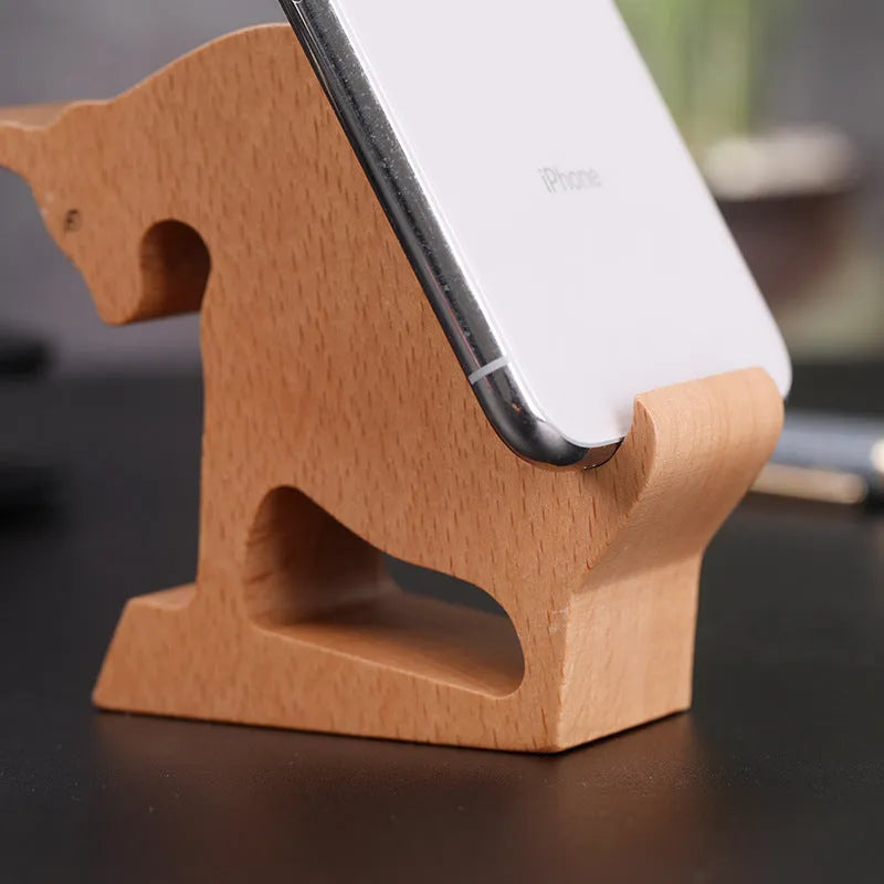 Beech wood mobile phone holder with resin animal decoration and custom lettering on coin back.