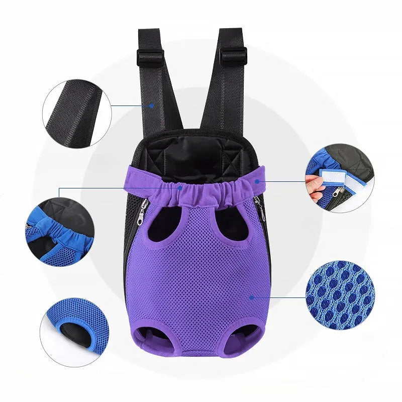 A person wearing a black nylon dog carrier backpack on their chest, containing a small dog looking out.