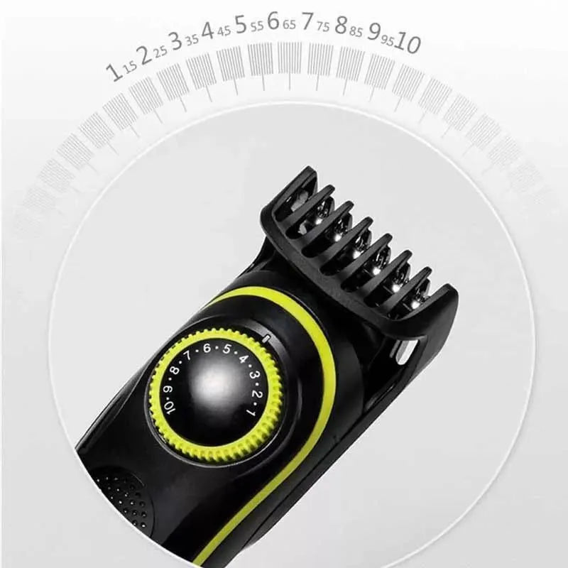 Black KM-696 USB rechargeable electric hair clipper set with stainless steel blades and cleaning brush.