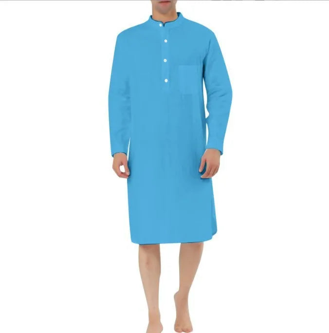 Man wearing a dark blue cotton shirt robe with button front and chest pockets.