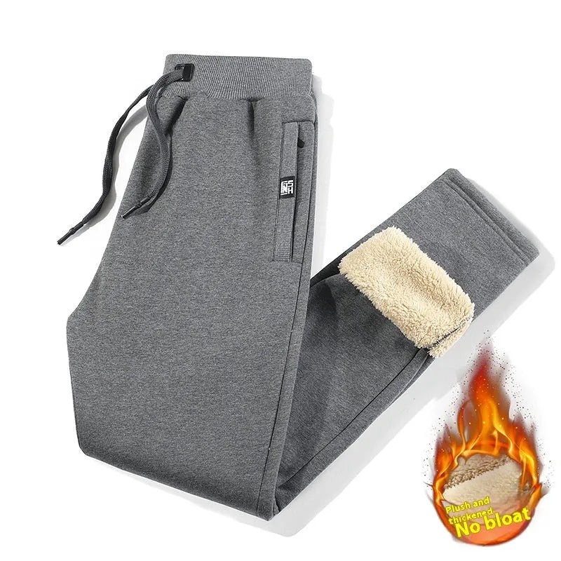 Men's fleece-lined track pants in grey or black with elastic mid-waist and plus-size fit options