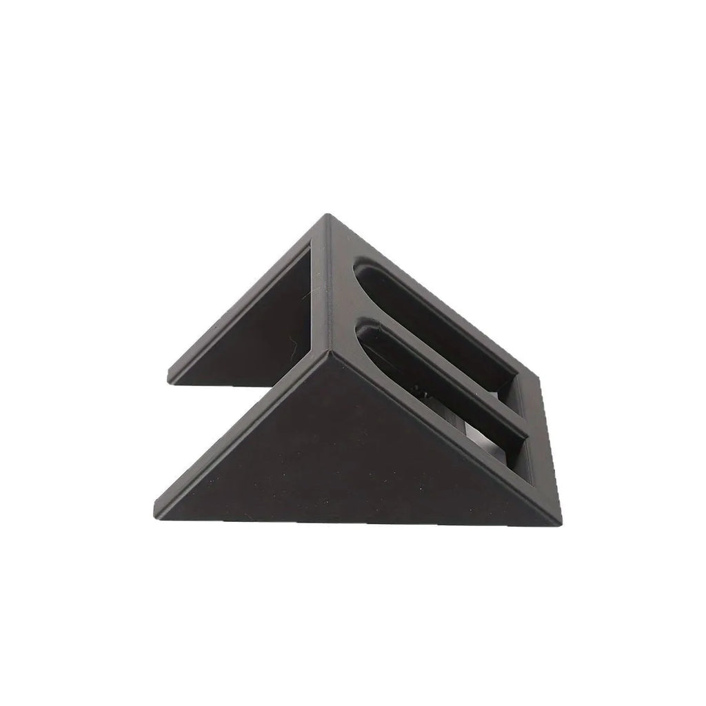 Black plastic punk-style pistol display stand on a flat surface.