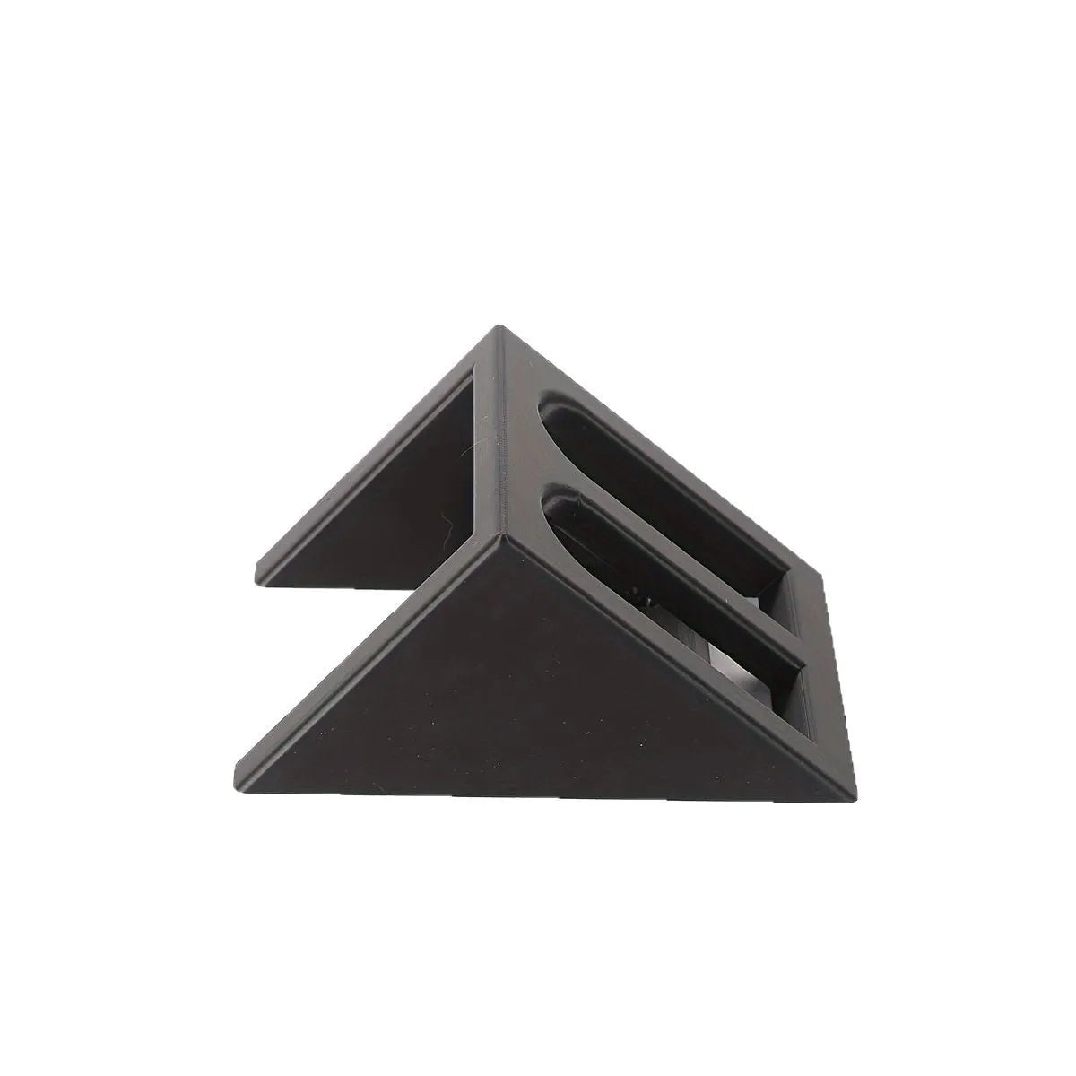 Black plastic punk-style pistol display stand on a flat surface.