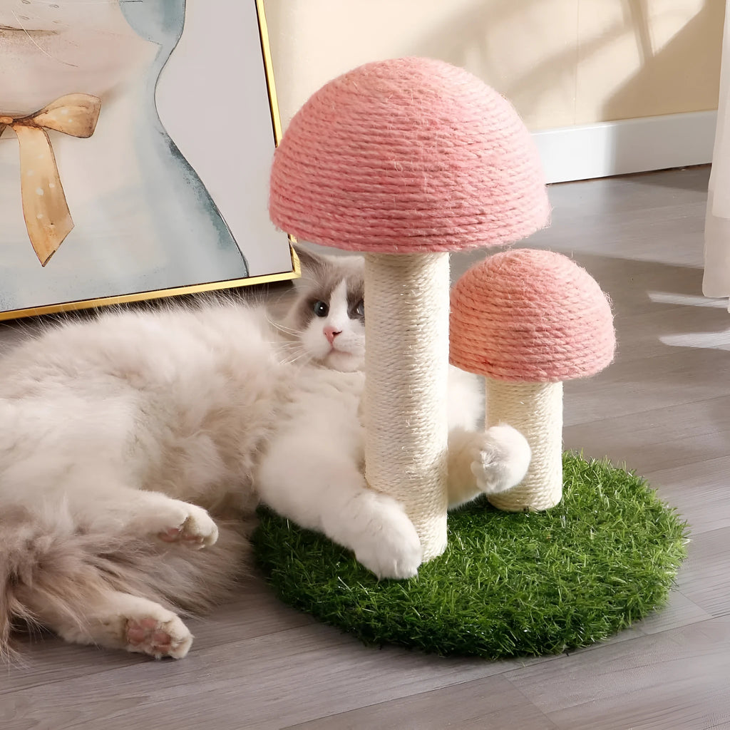 Pink mushroom-shaped cat scratching post with sisal fabric, for small cats and kittens.