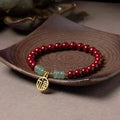 Handcrafted gold cinnabar wave bracelet with copper beads in national style design
