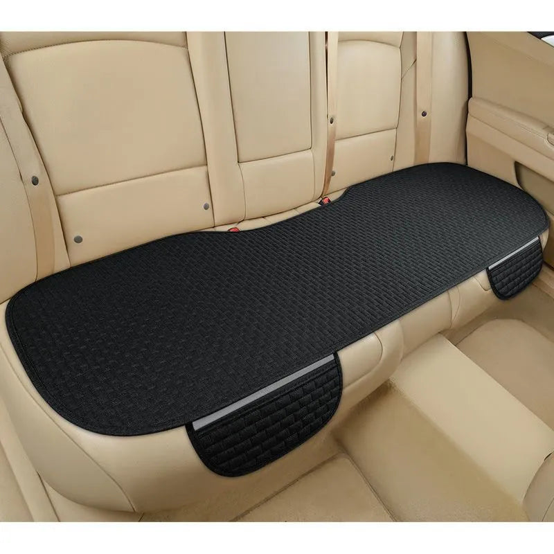 Linen car cushion set in classic plaid pattern showing three colour options: black and red, coffee and cream