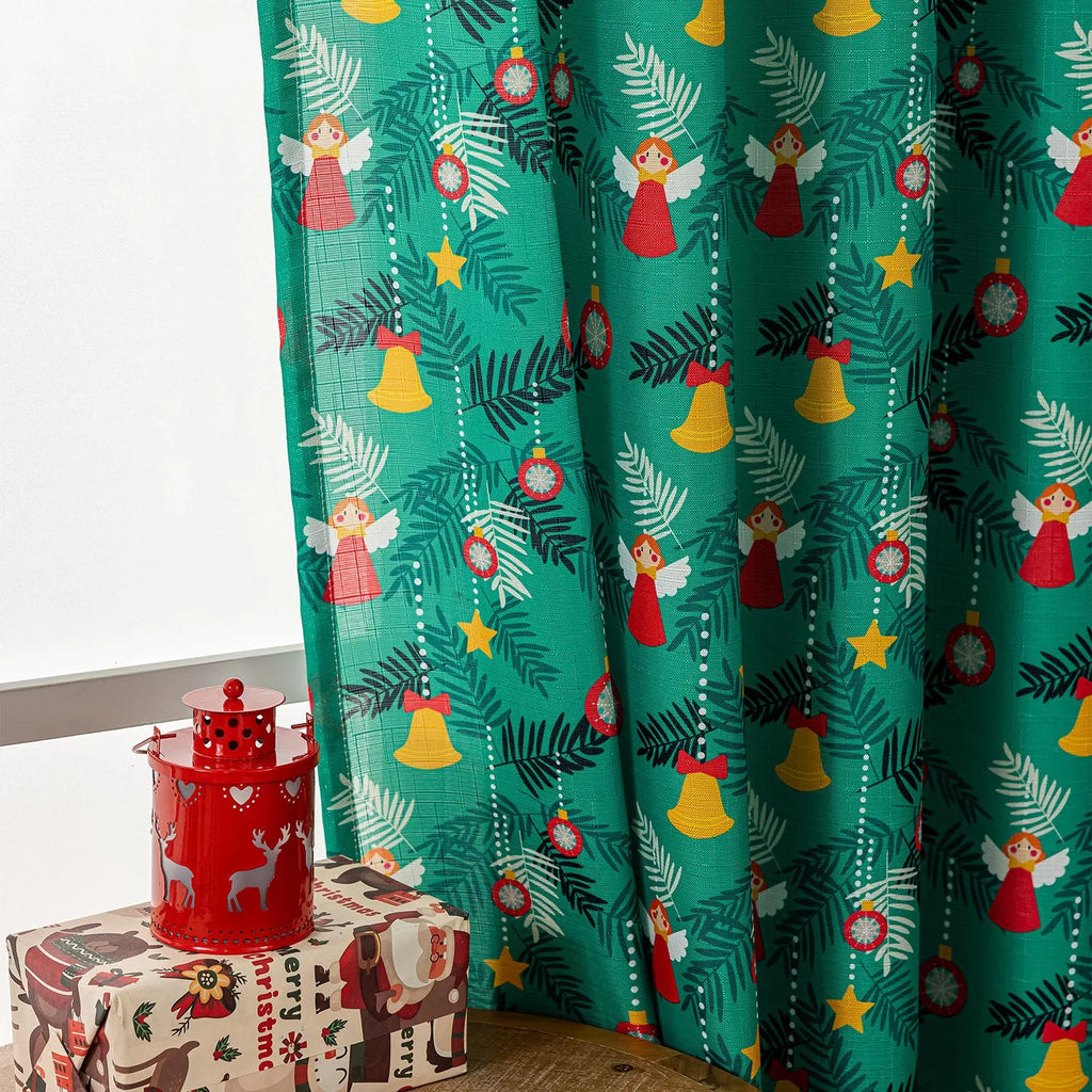 Green cotton Christmas curtain with printed snowman angel cartoon pattern measuring 1 metre length