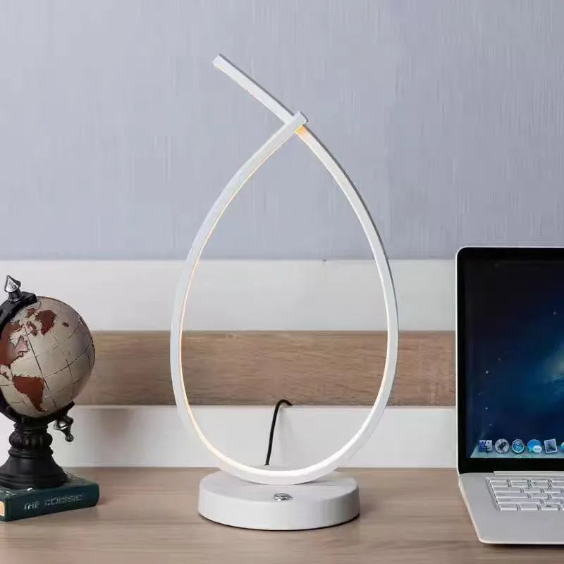 Black and white USB touch control table lamp with water drop shape measuring 30cm tall