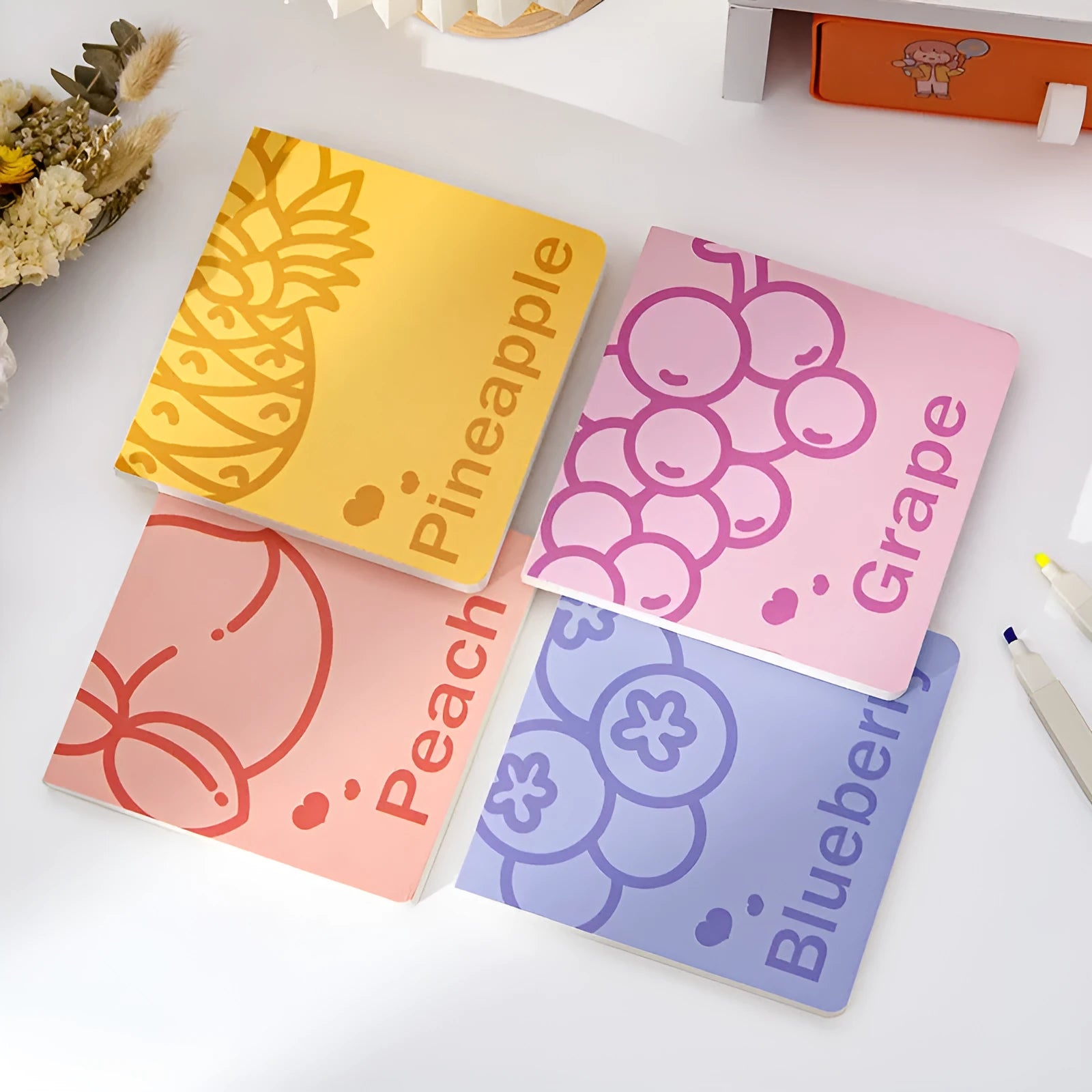 Square notebook with embossed fruit cover showing pineapple design, 14.5cm dimensions
