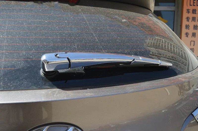 Set of four silvery ABS plastic rear window wiper cover trim strips for a 2010 Hyundai.