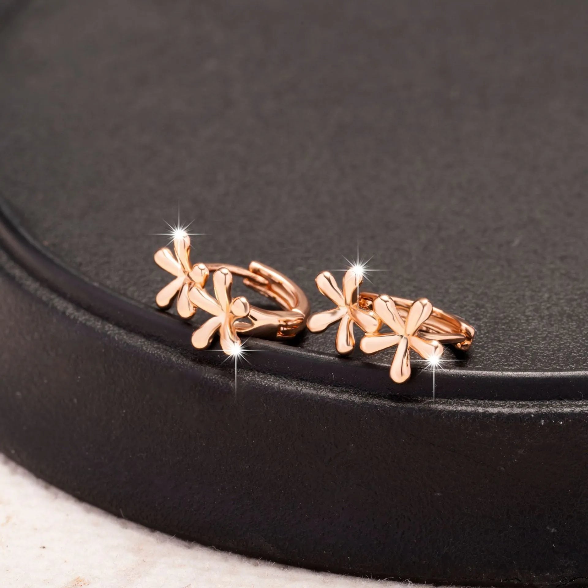 Rose gold waterdrop flower earrings with circular design and electroplated finish