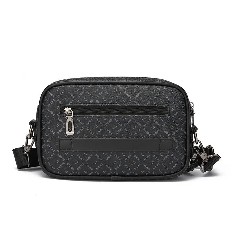 Men's black geometric pattern messenger bag shown in horizontal carrying position with shoulder strap
