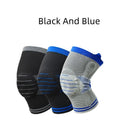 A cotton knee pad with a visible silicone massage spring bar shock absorber, shown in a grey and blue colour combination.