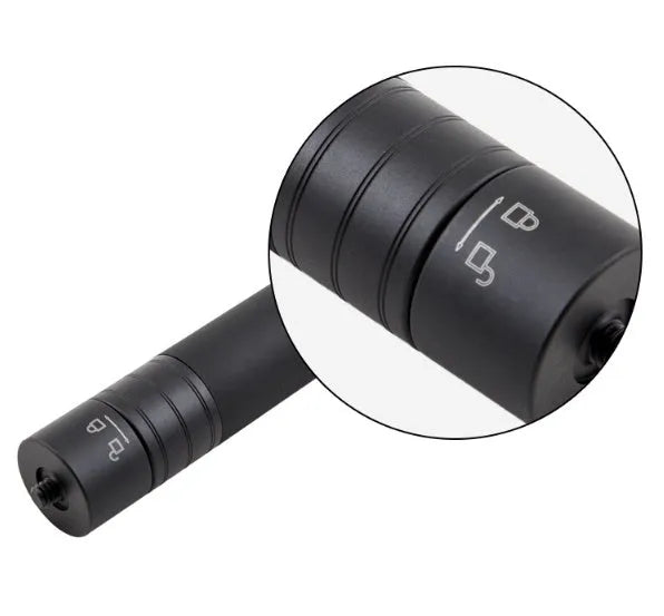 Black retractable selfie stick extended with phone in holder and visible wrist strap.