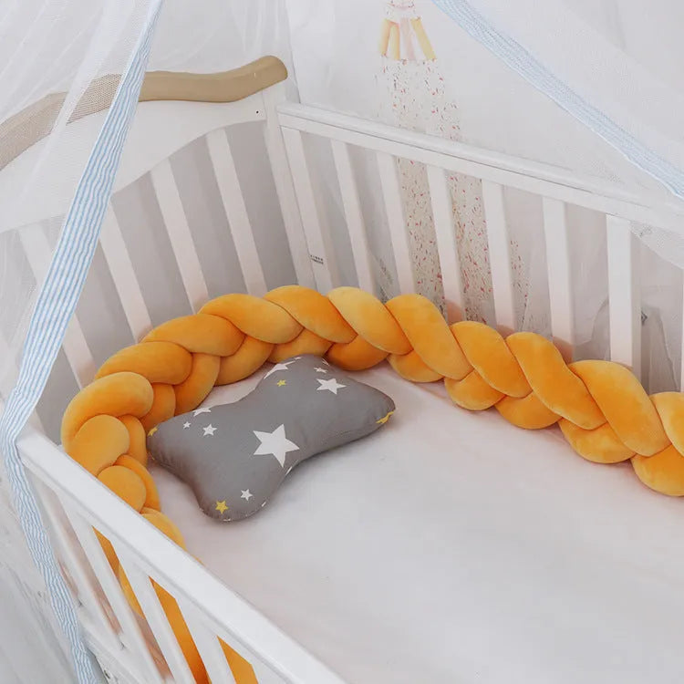 Baby crib bumper in crystal velvet with braid knot design showing flexible length options for cot protection