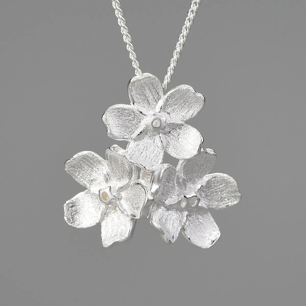 Myosotis Sylvatica sterling silver pendant with floral design in gold, silver, or silver gold electroplated finish.