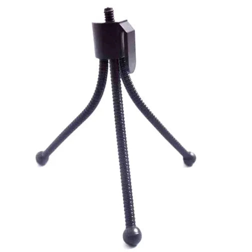 Small black iron mini tripod with ball head, shown extended next to a smartphone for scale.