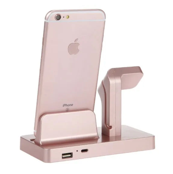 White 2-in-1 charging dock station holding an iPhone and an Apple Watch on a wooden desk.