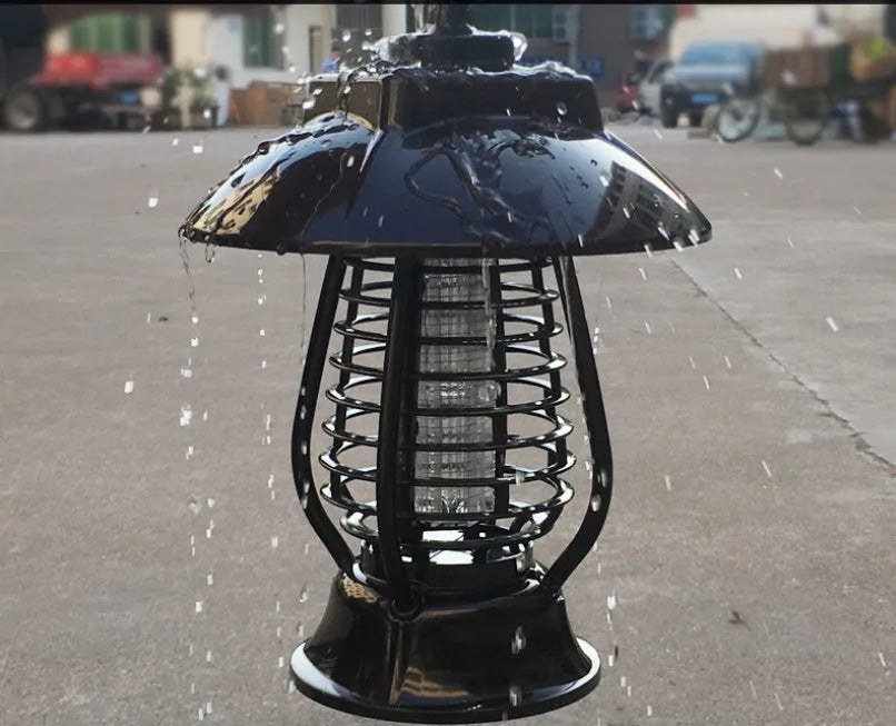 Black solar-powered mosquito lamp with solar panel and white LED light for outdoor insect control