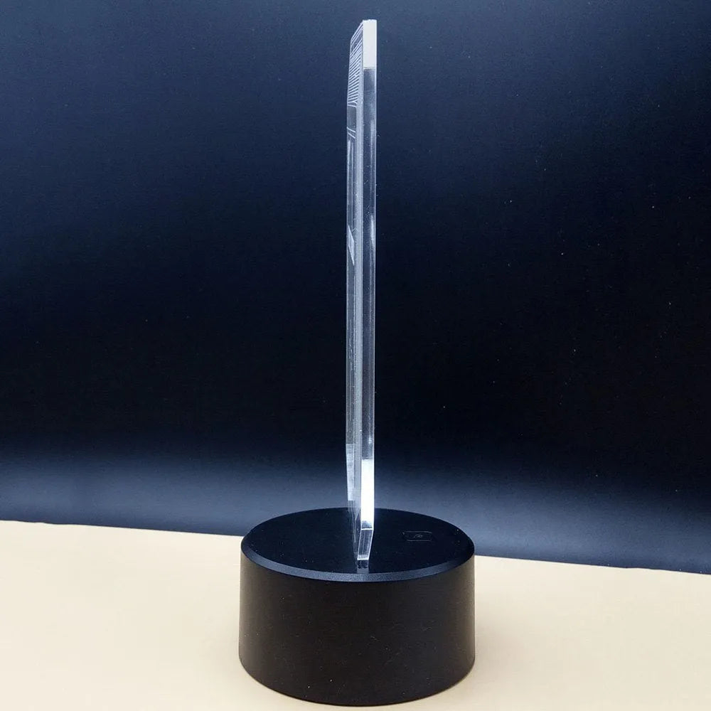 3D brain illusion LED lamp with acrylic plate glowing in multiple colours on a desk