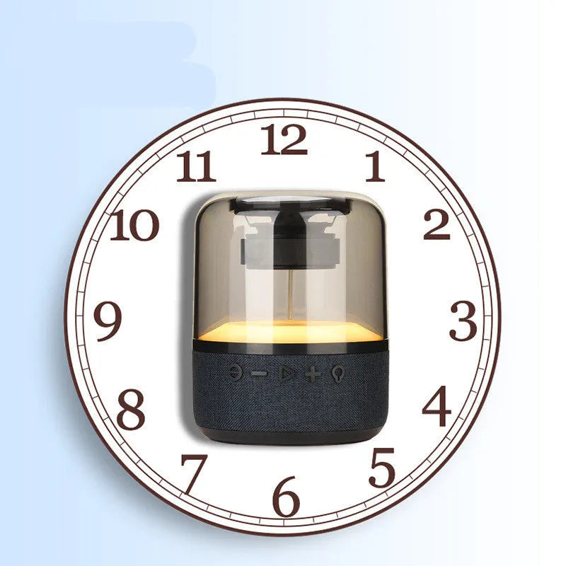 Black wireless Bluetooth speaker with LED lighting and touch controls showing four colours