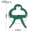 Green plastic and zinc plant fixing clips in large and small sizes for tomatoes and climbing plants