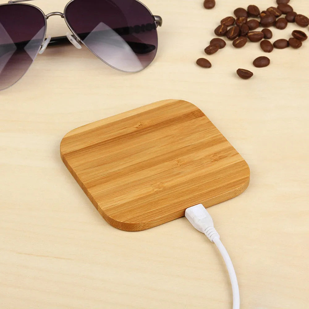 Square wooden bamboo 5W QI wireless charging pad on a desk