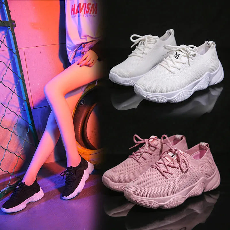 Women's white thick-soled sports shoes with woven mesh upper and front adjustable strap.
