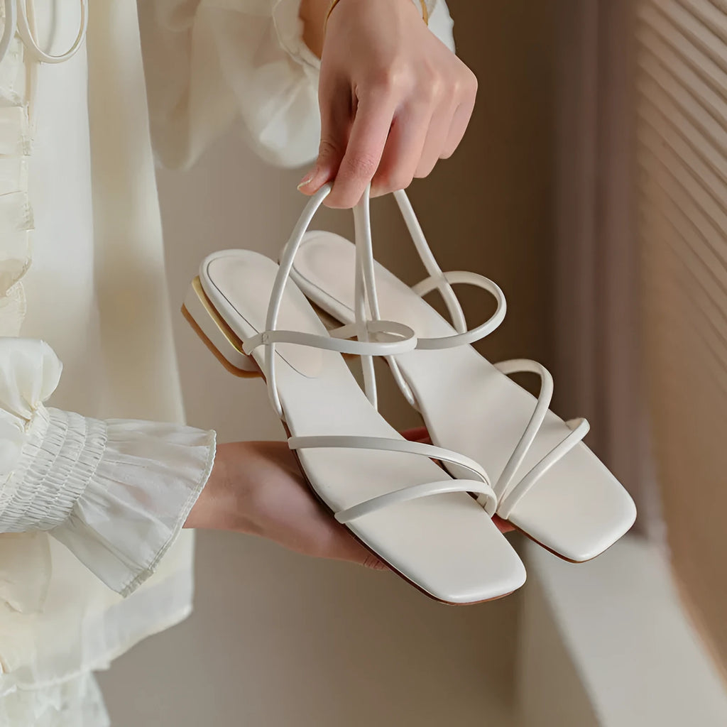 Women's flat strap open-toed Roman sandals in Microfiber with a square toe, shown in beige colour.
