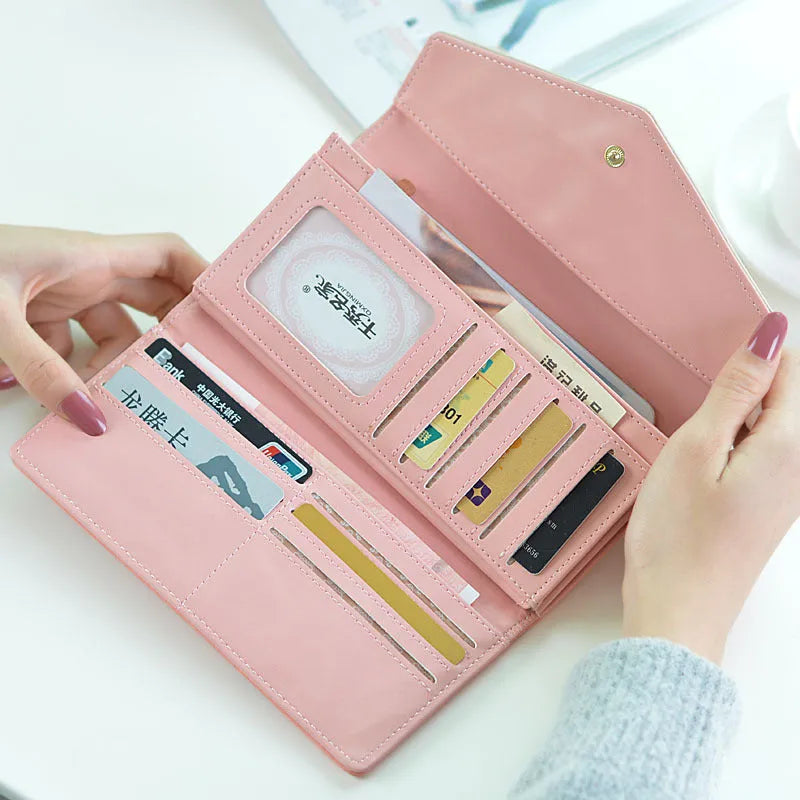 Black three-fold PU leather wallet with a metal buckle closure, shown open to reveal card slots and compartments.