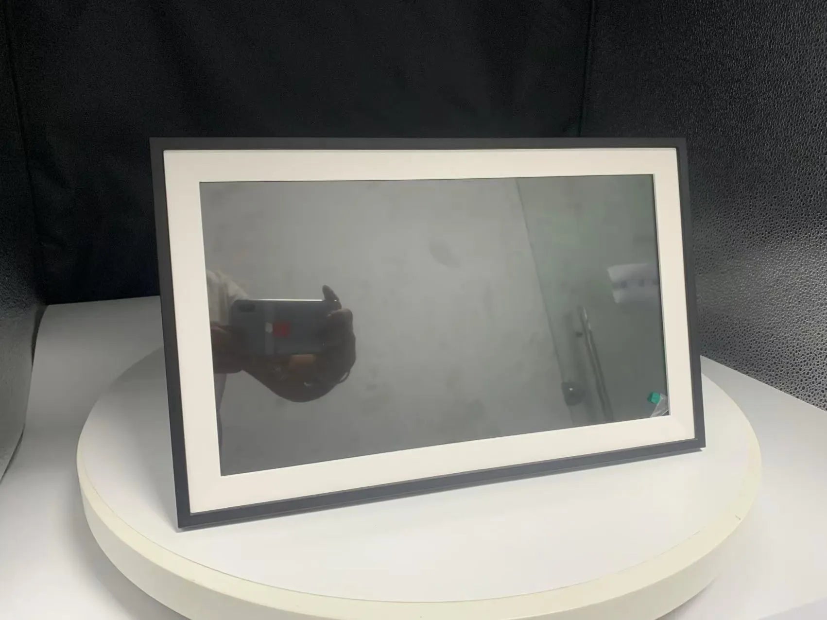 White 15.6 inch smart digital photo frame with app connectivity showing full HD display of family photos