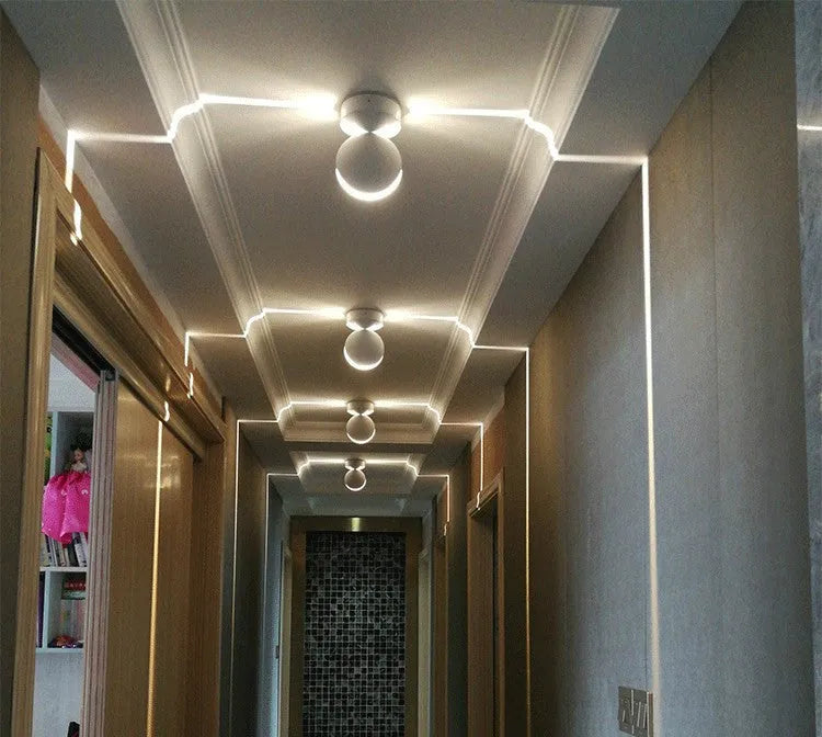 Modern aluminium spotlight bar wall lamp with glass lens and coloured LED illumination