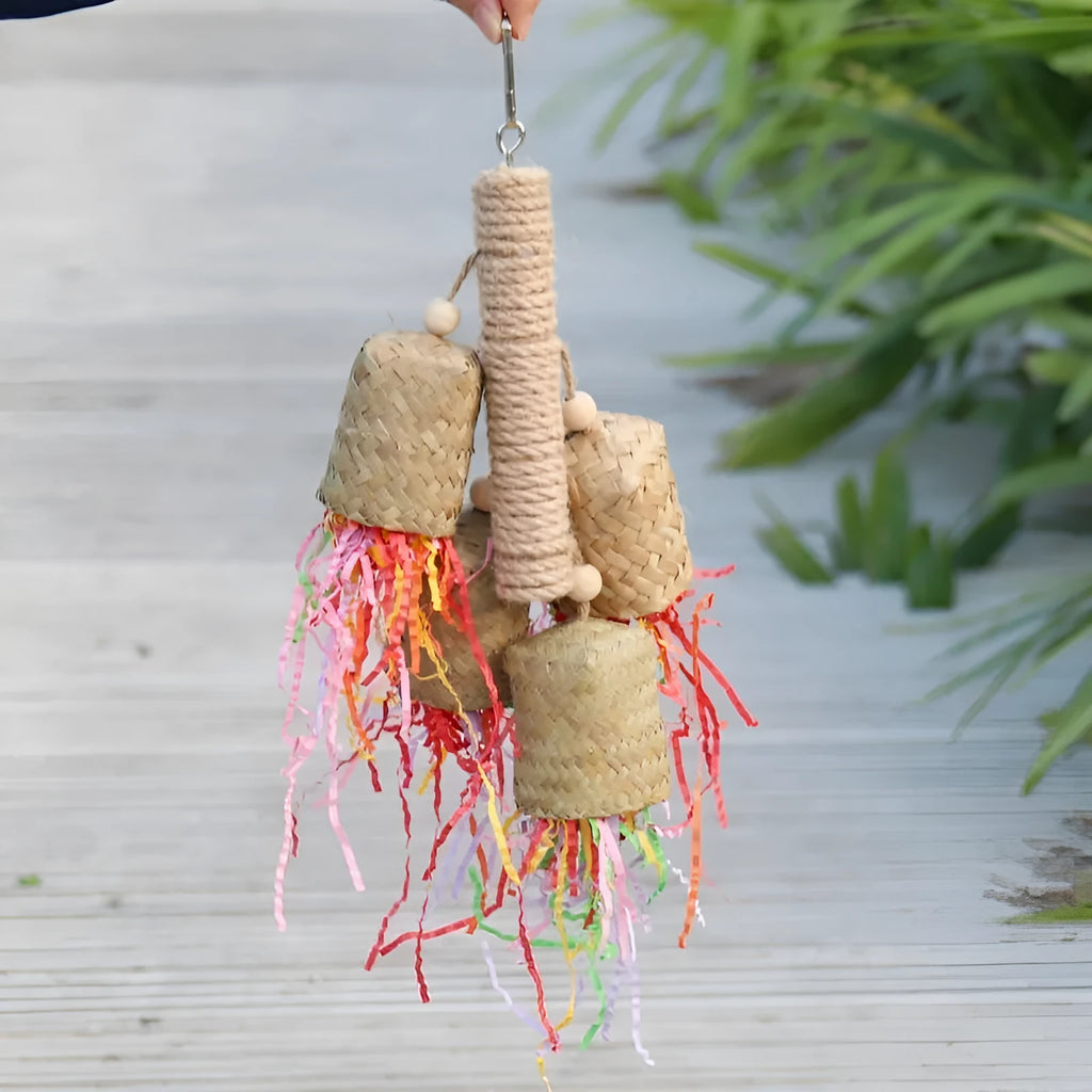 Colourful shredded paper parrot toy with wood and sisal construction hanging